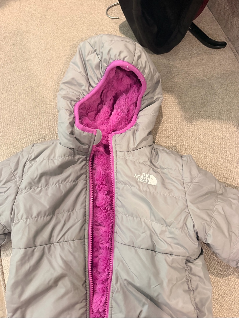 The North Face Kids Gray Puffer Jacket with Bright Pink Fleece Lining